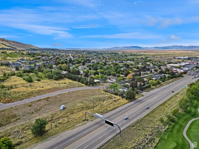 Aerial view of residential area featuring mountains