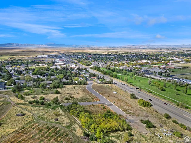 Aerial view of residential area featuring a mountain backdrop