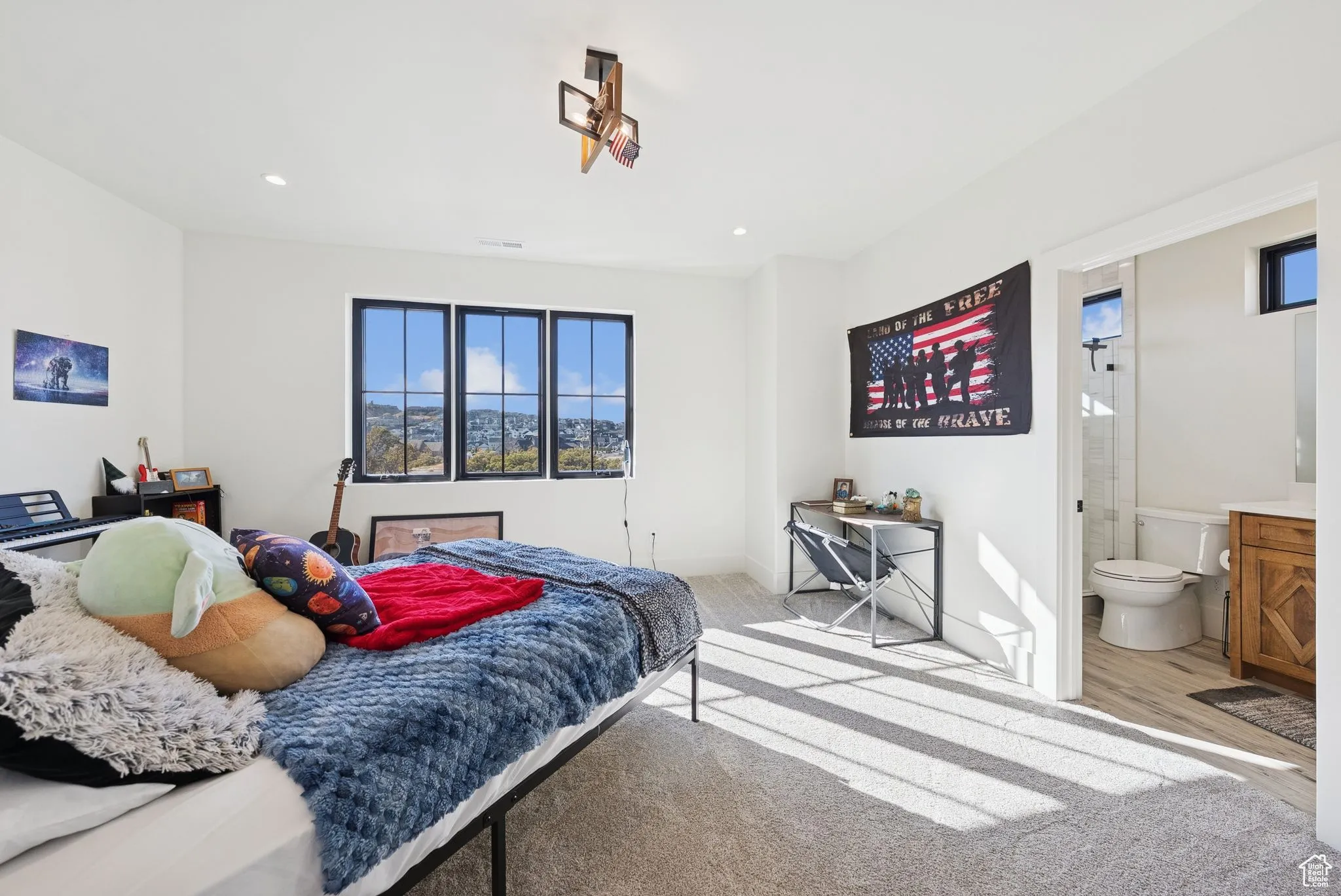 Bedroom featuring recessed lighting, light colored carpet, and light wood-type flooring