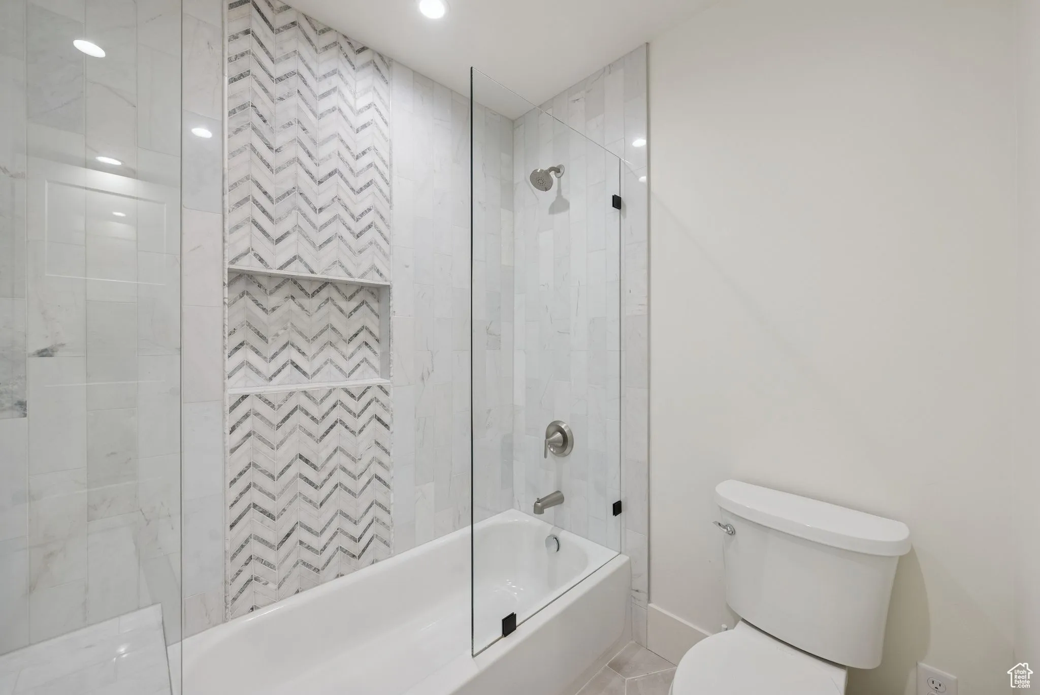 Full bath featuring shower / washtub combination and toilet