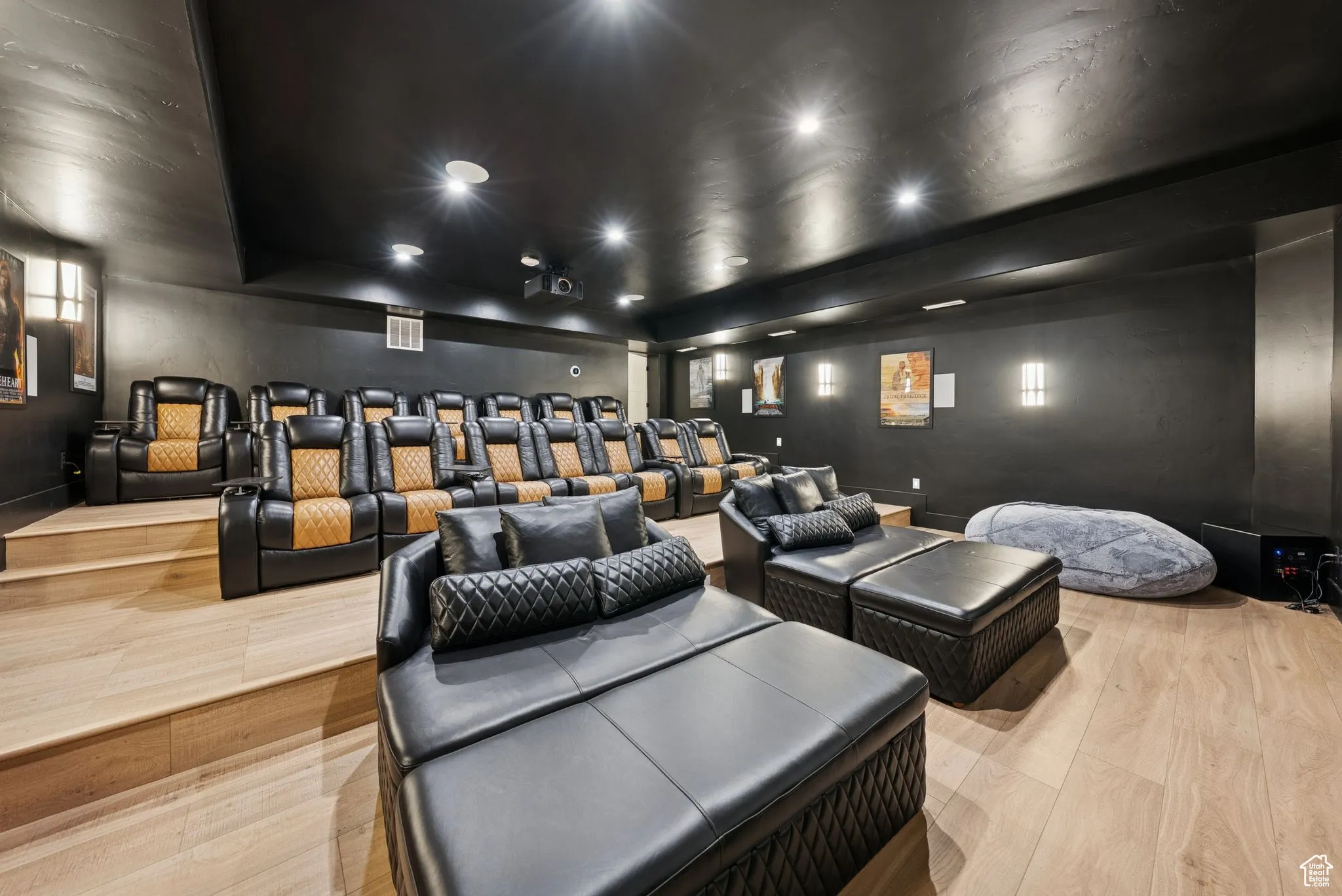 Home theater room featuring light wood finished floors