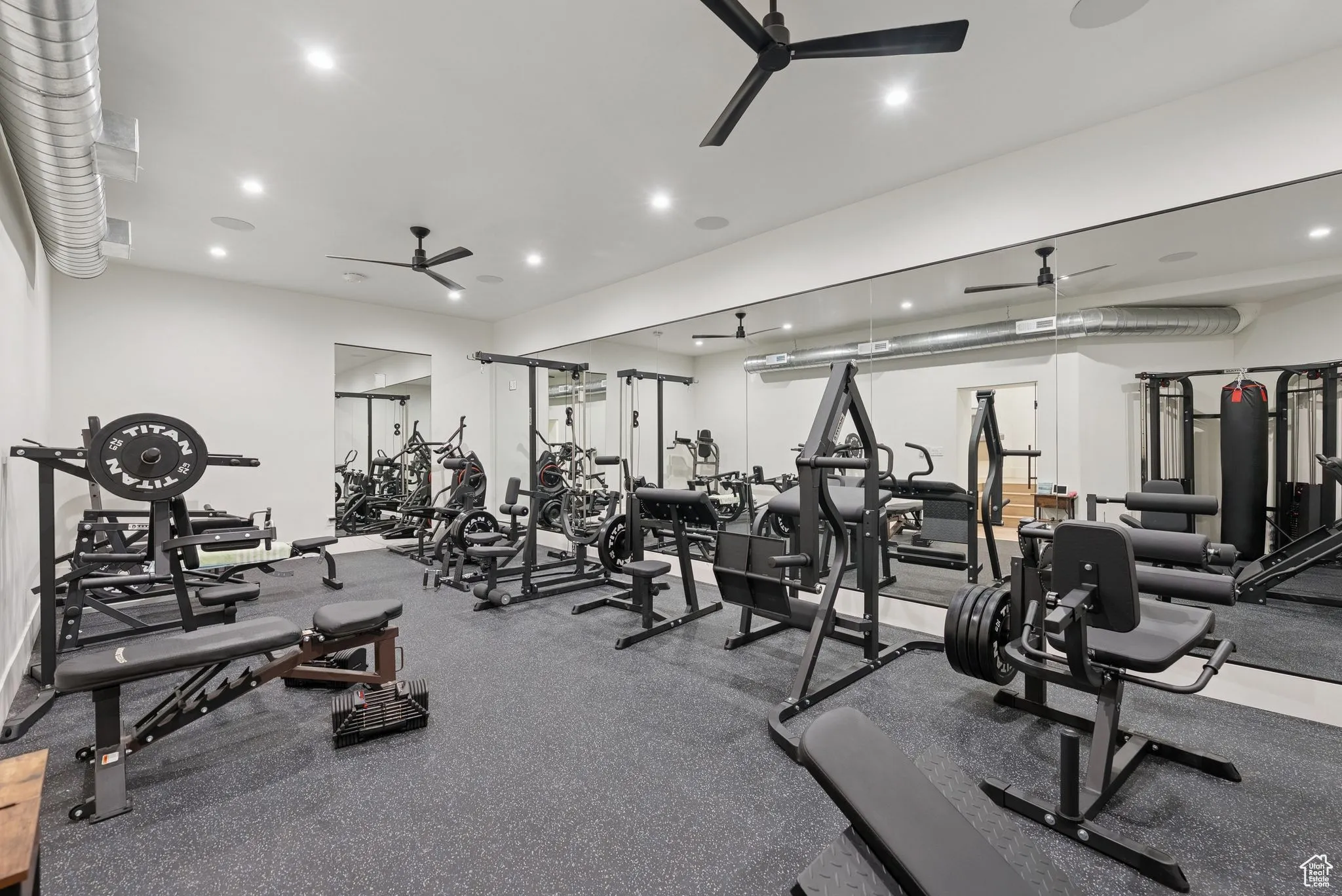 Exercise room featuring recessed lighting