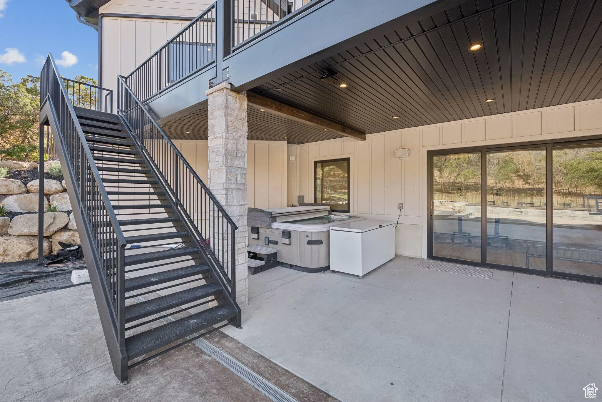 View of patio featuring stairs
