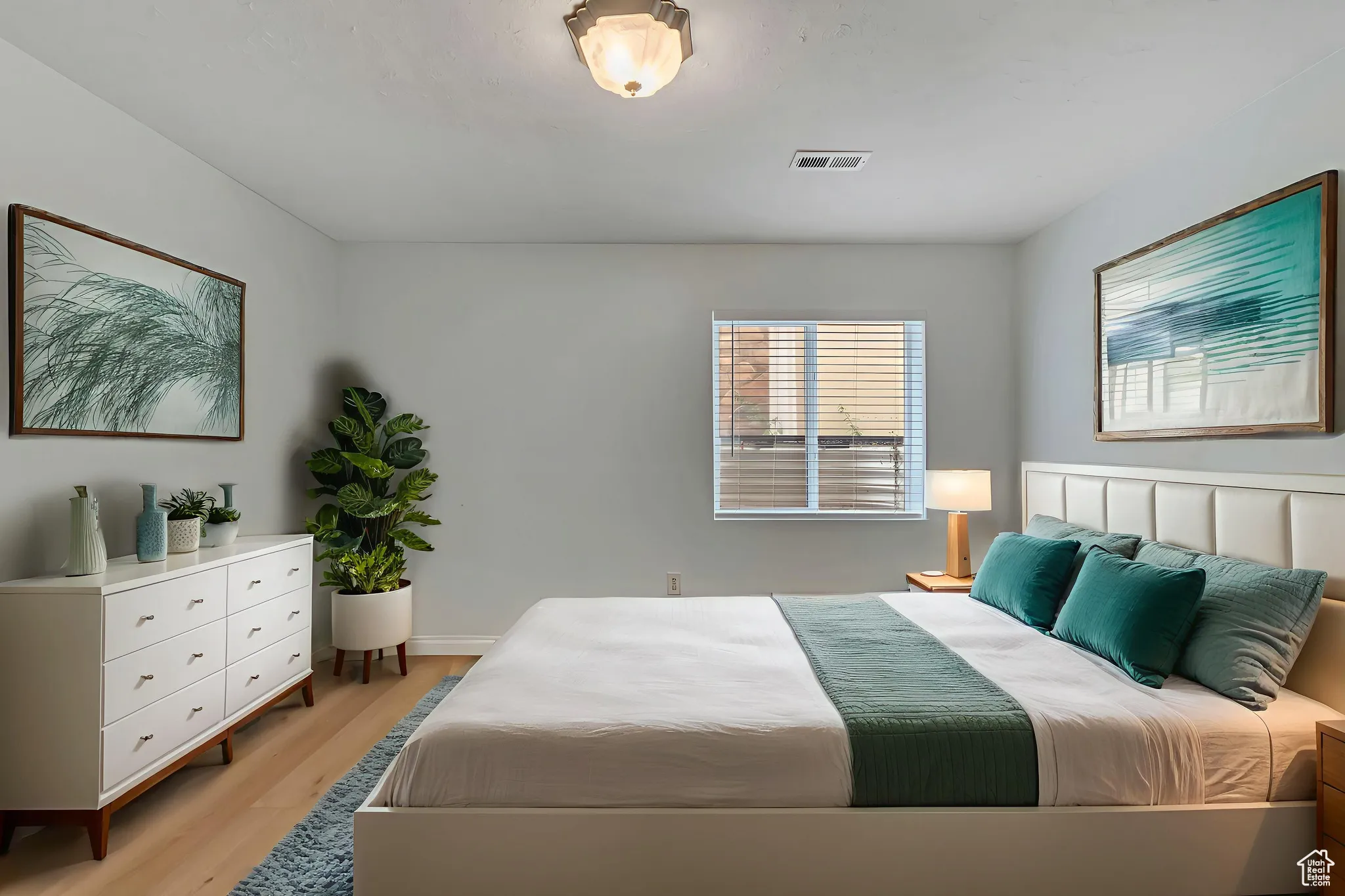 VIRTUALLY STAGED -- Basement bedroom with light wood finished floors and baseboards