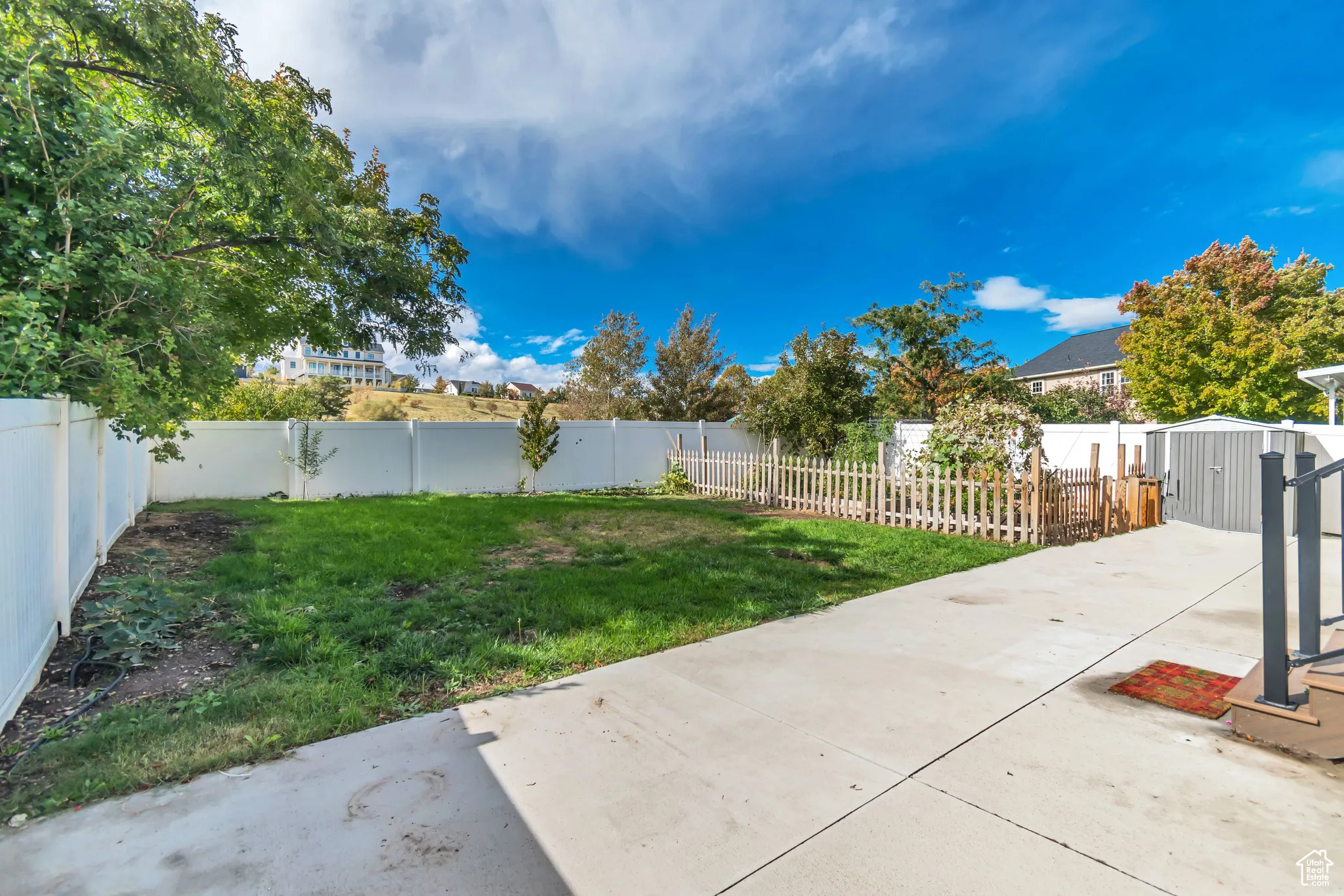 Fenced backyard featuring a patio area