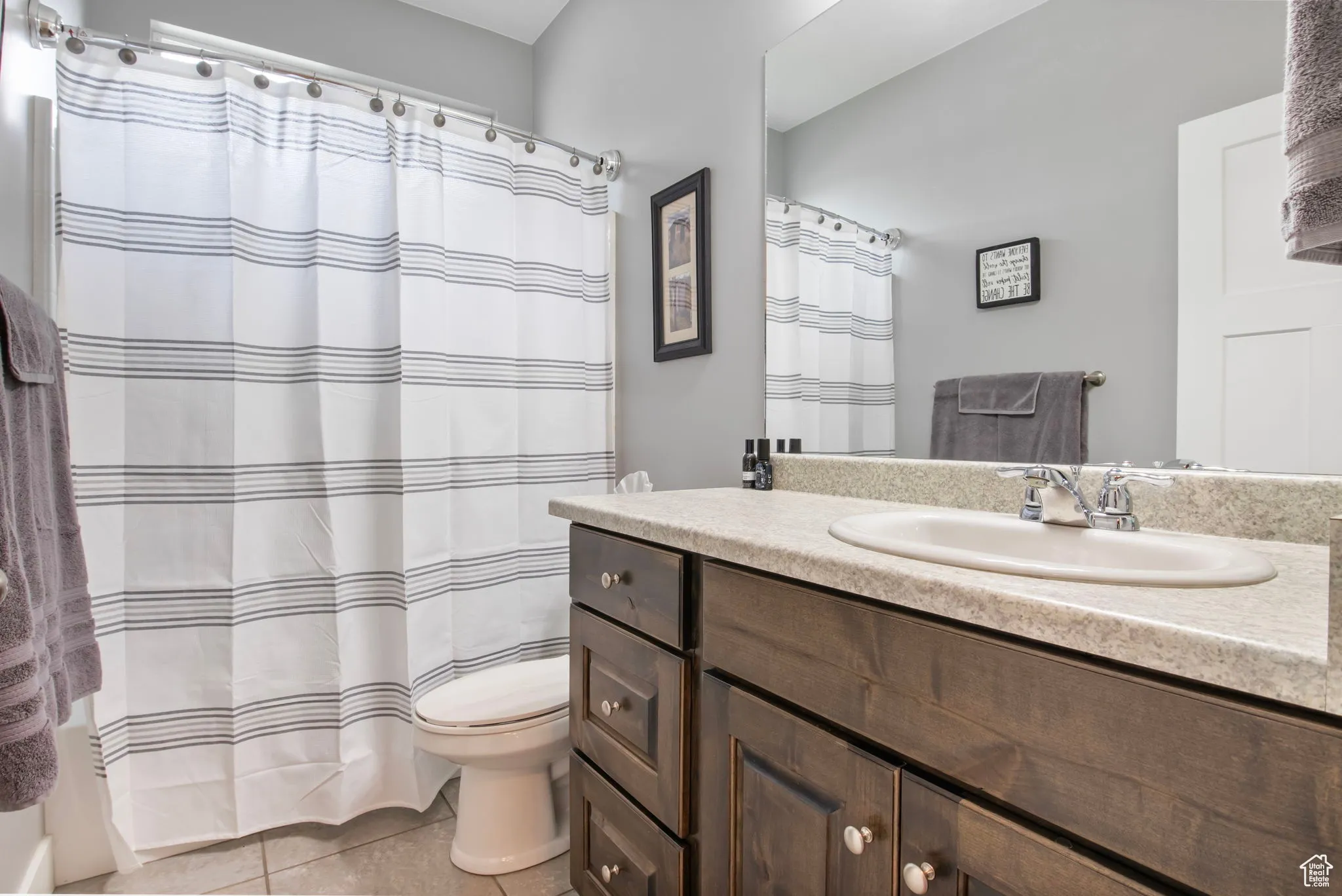 Bathroom featuring vanity and light tile patterned floors