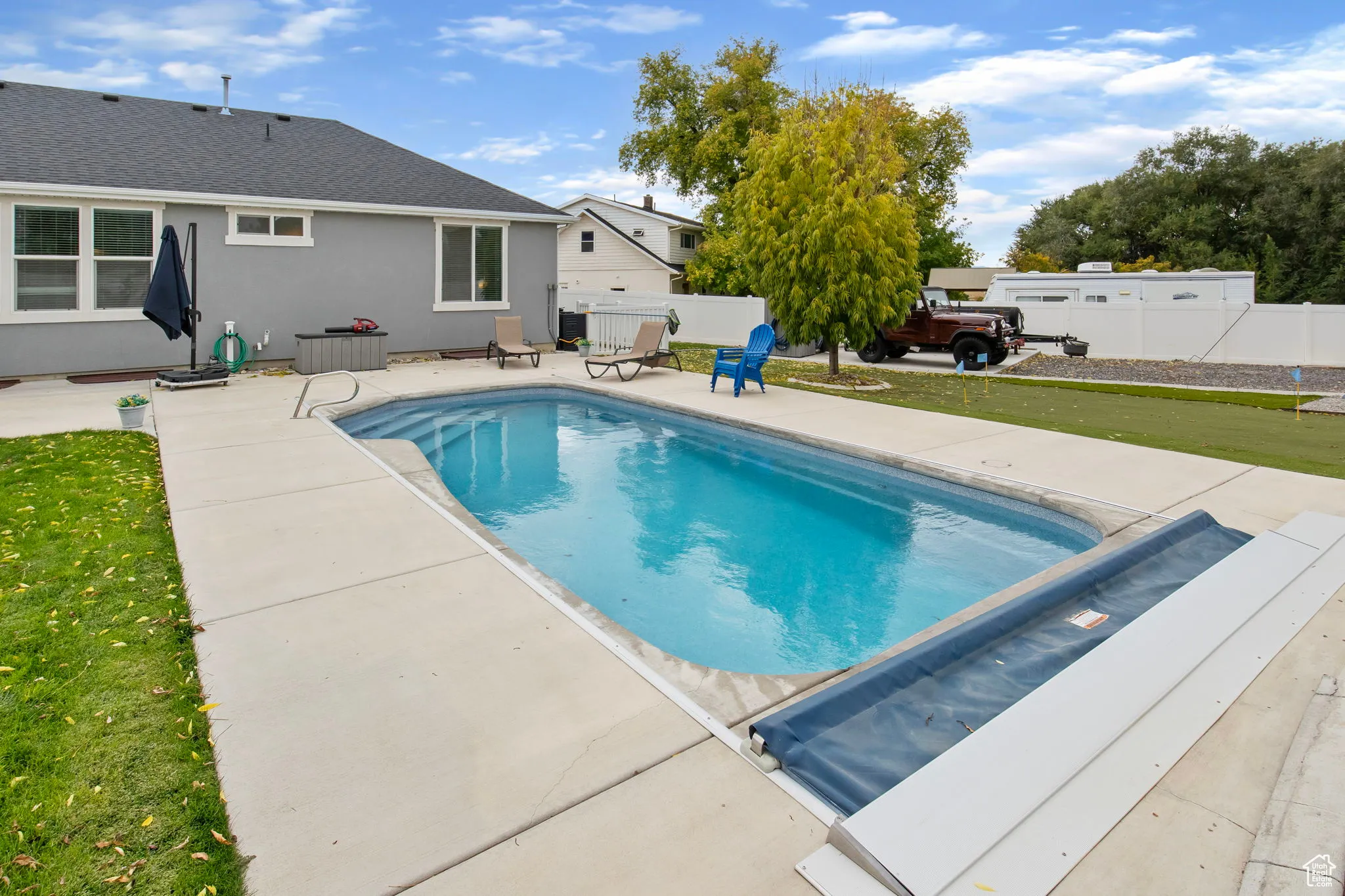 View of pool with a patio and a fenced backyard