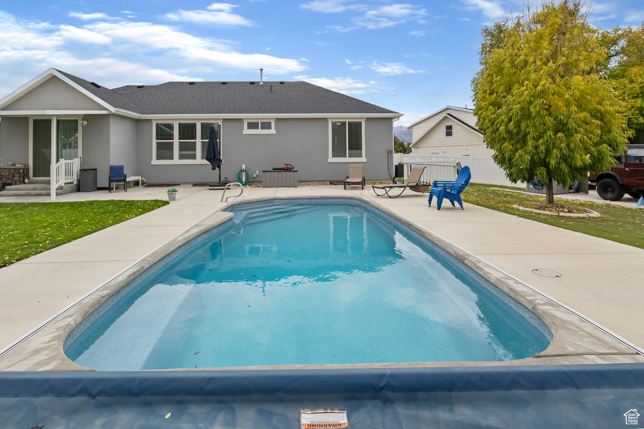 Outdoor pool with a patio