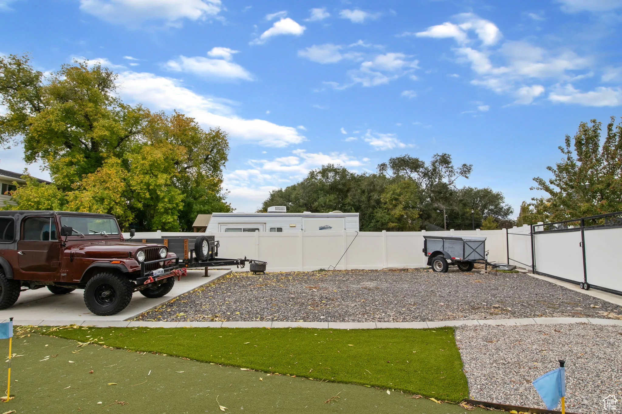 View of fenced backyard