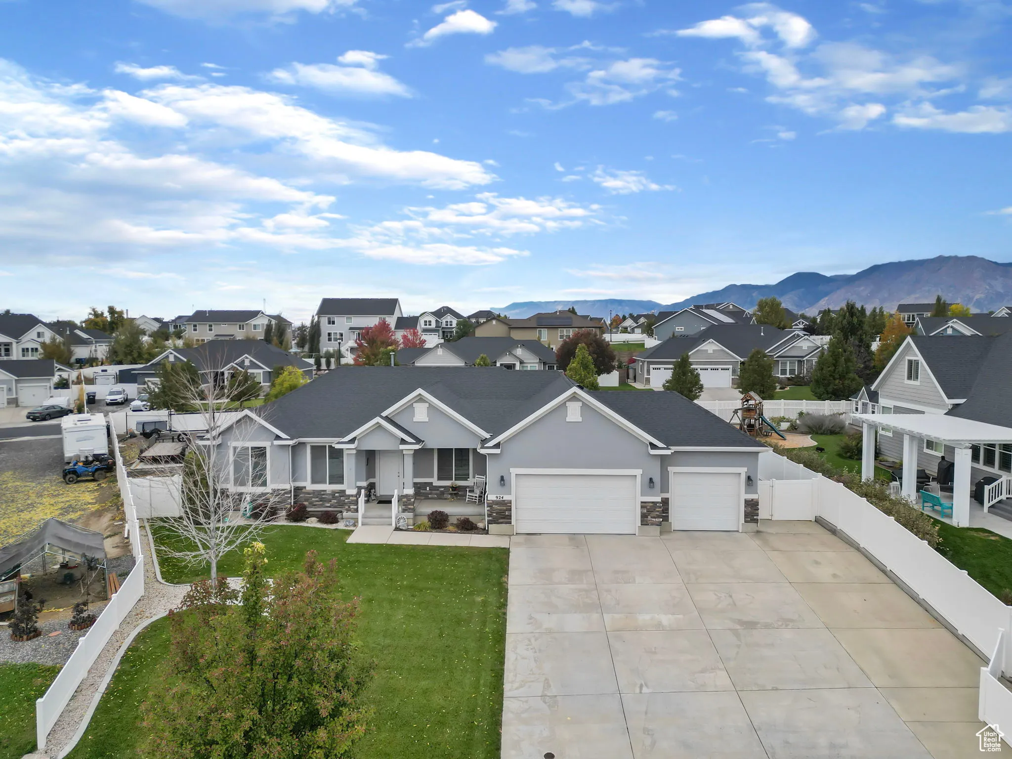 Aerial perspective of suburban area with a mountain backdrop
