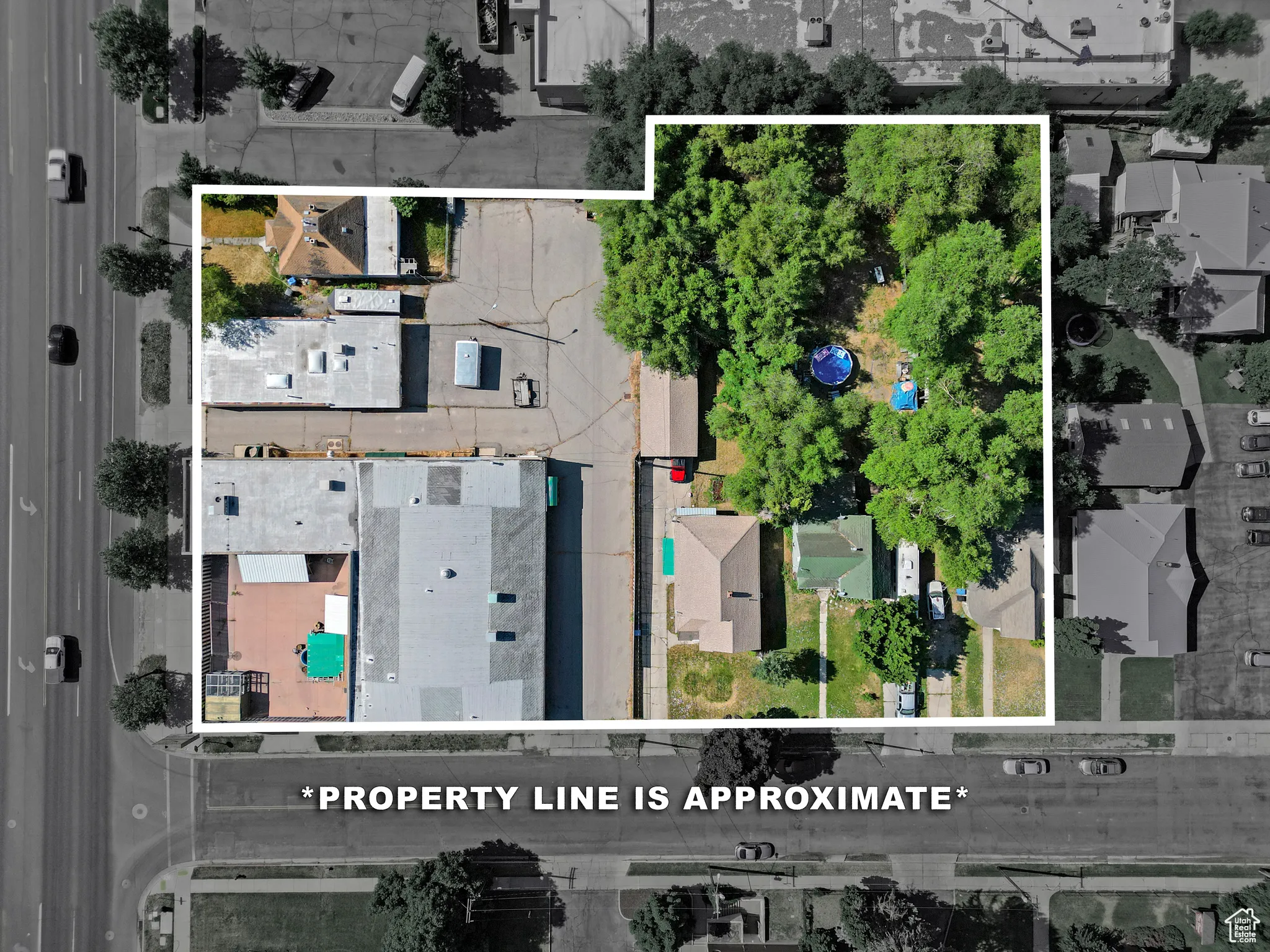 Aerial view of residential area featuring property boundaries highlighted