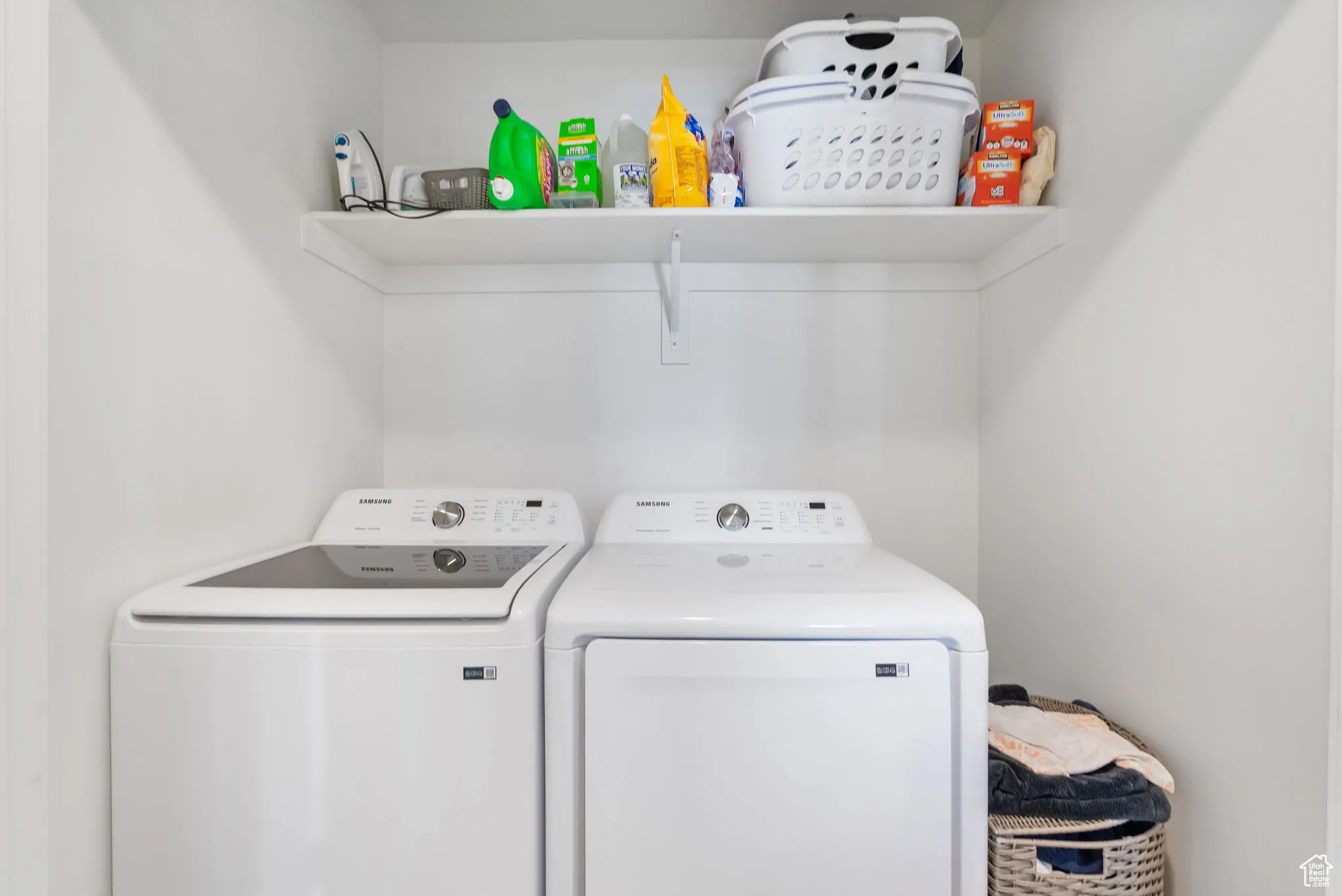 Laundry room with washer and clothes dryer