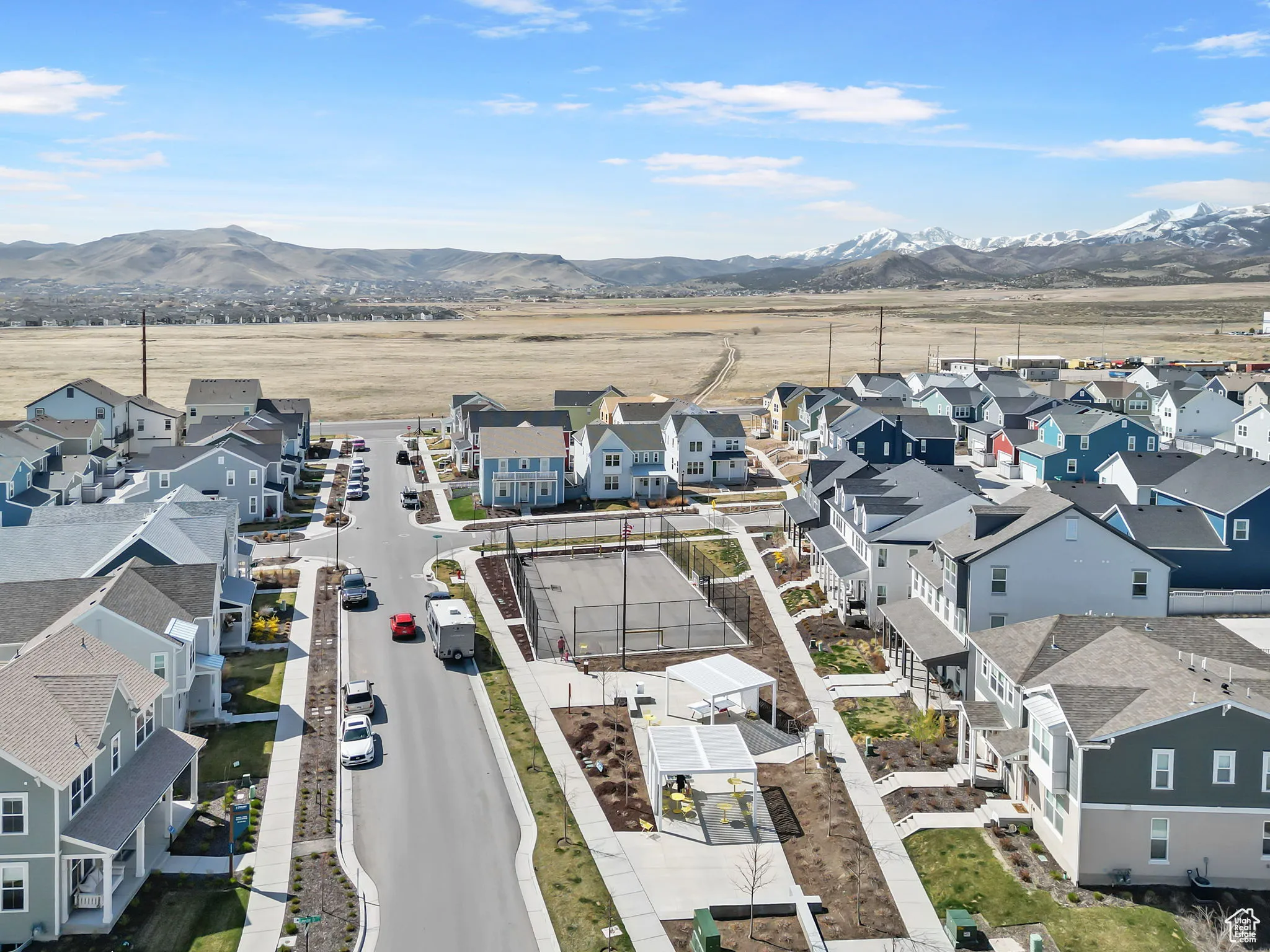 Aerial perspective of suburban area featuring a mountain backdrop