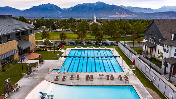Community pool featuring a patio area and a mountain view