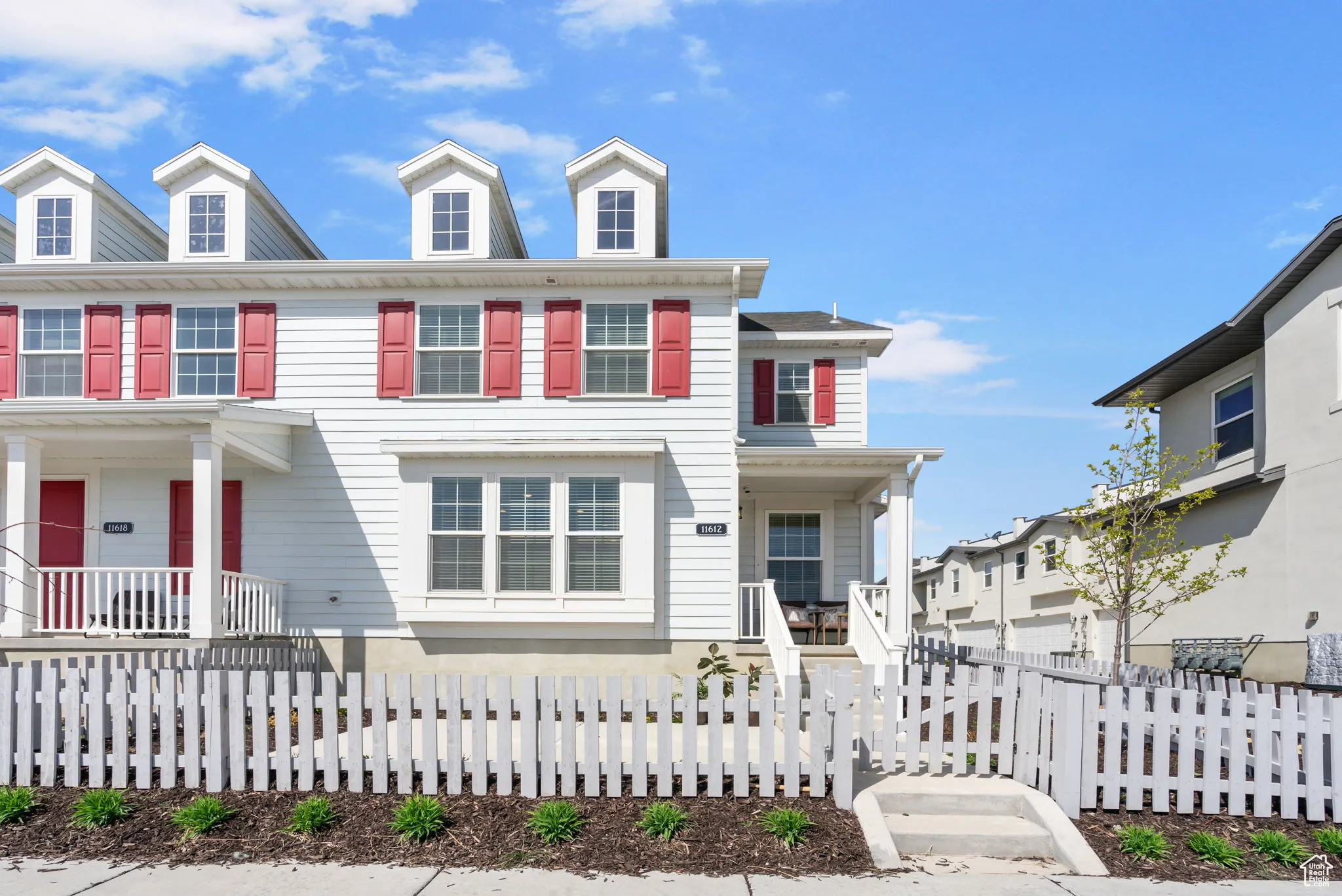 Colonial inspired home featuring covered porch