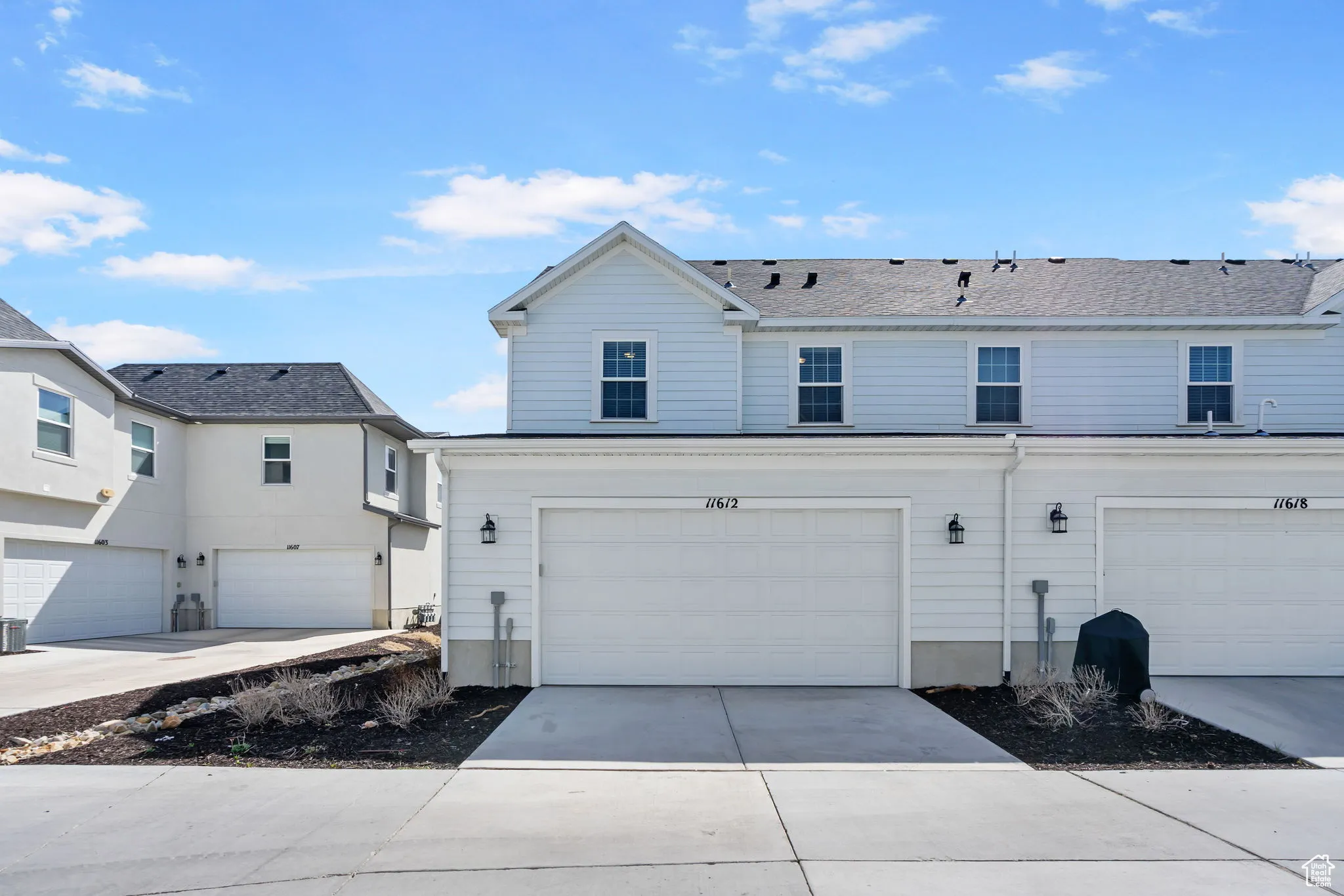 View of front of house featuring driveway and an attached 2 car  garage