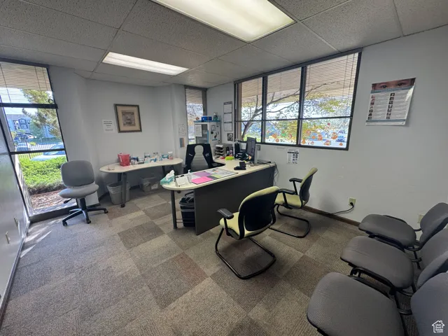 Office area featuring a paneled ceiling