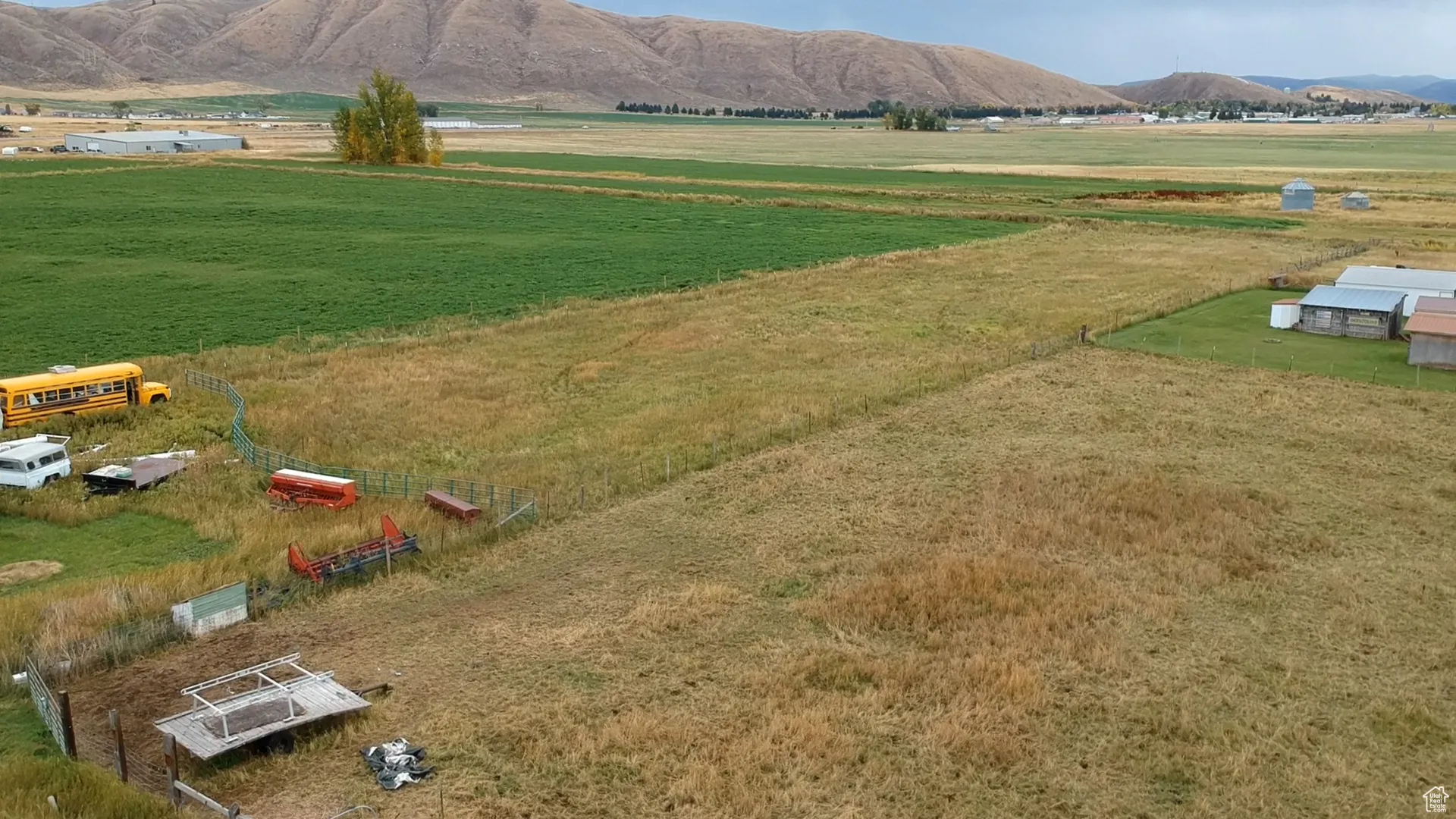 Aerial view of sparsely populated area featuring a mountainous background