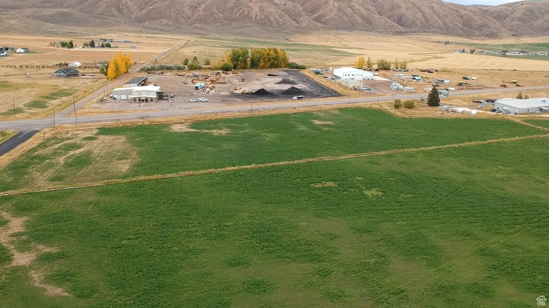 Aerial view of sparsely populated area with a mountainous background