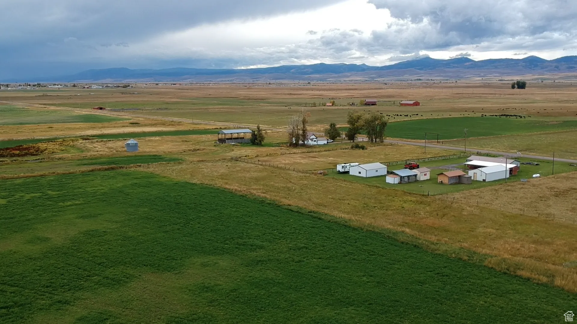 Overview of rural landscape with a mountain backdrop