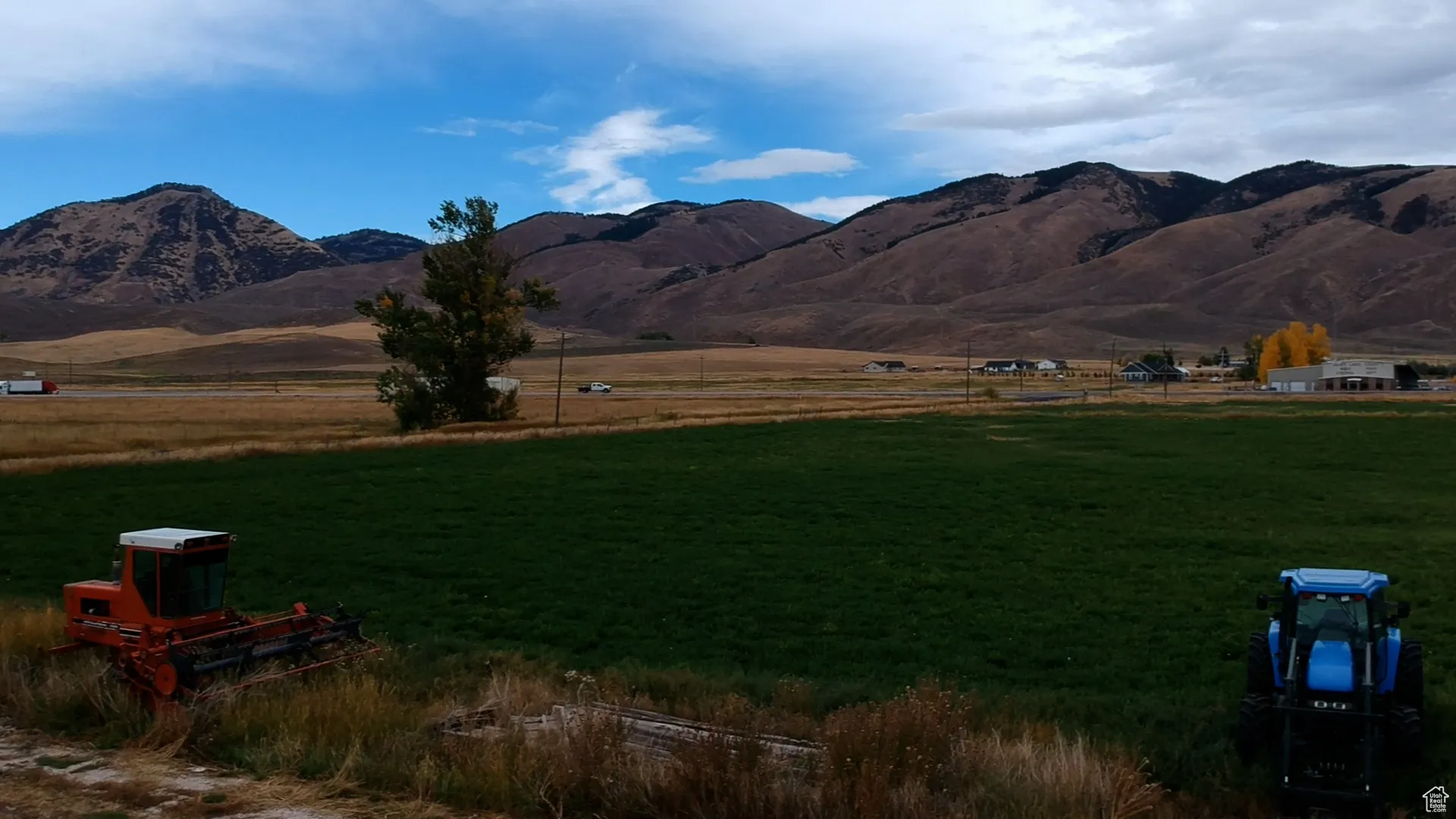 View of mountain background featuring rural landscape