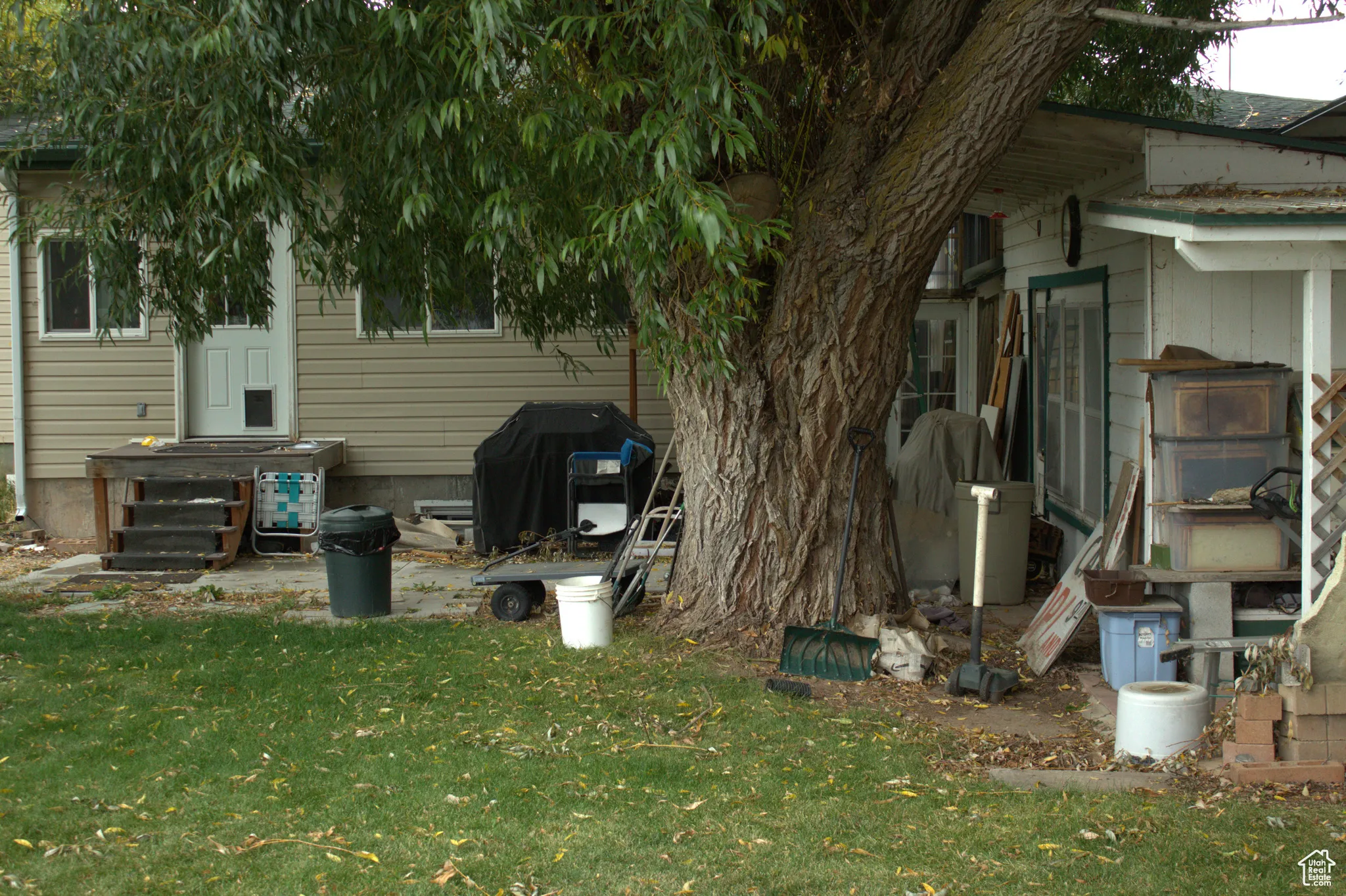 View of home's exterior with a yard