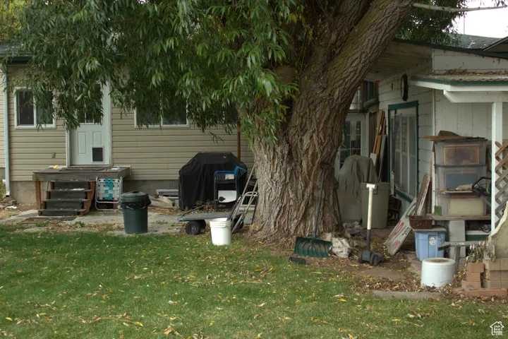View of home's exterior with a yard