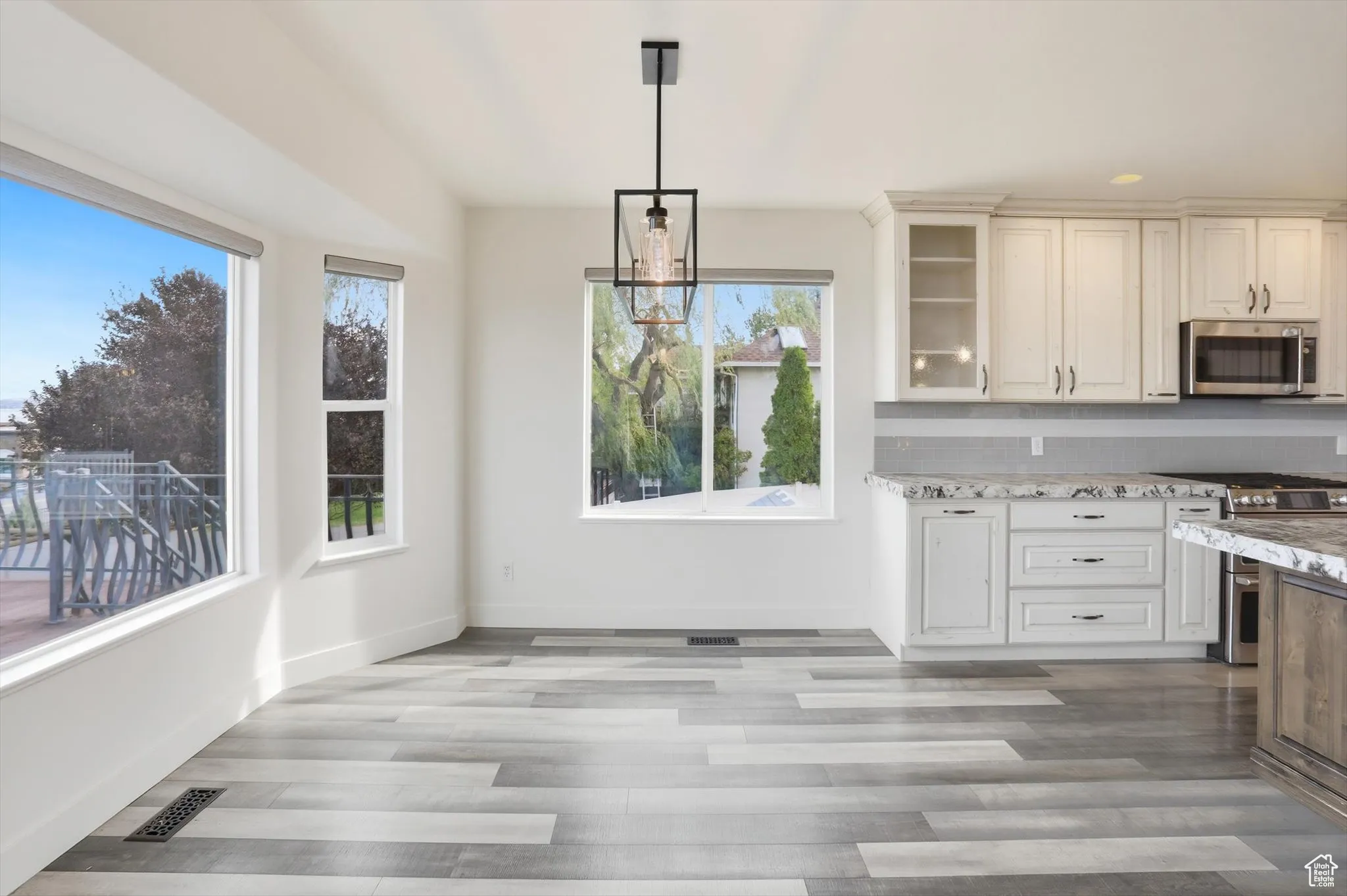 Unfurnished dining area with recessed lighting and light wood-style floors