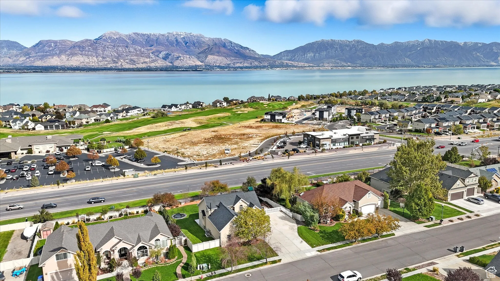 Aerial perspective of suburban area with a water and mountain view