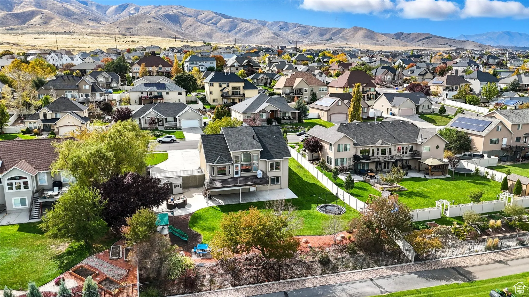 Aerial perspective of suburban area with a mountainous background