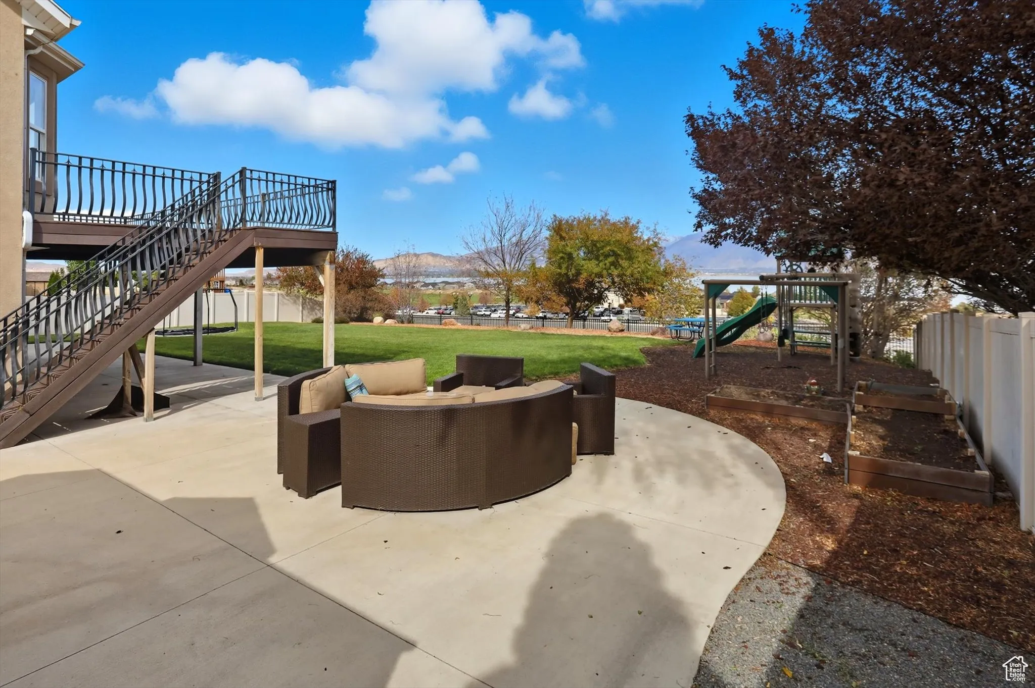 View of patio / terrace featuring a wooden deck, outdoor lounge area, and stairway