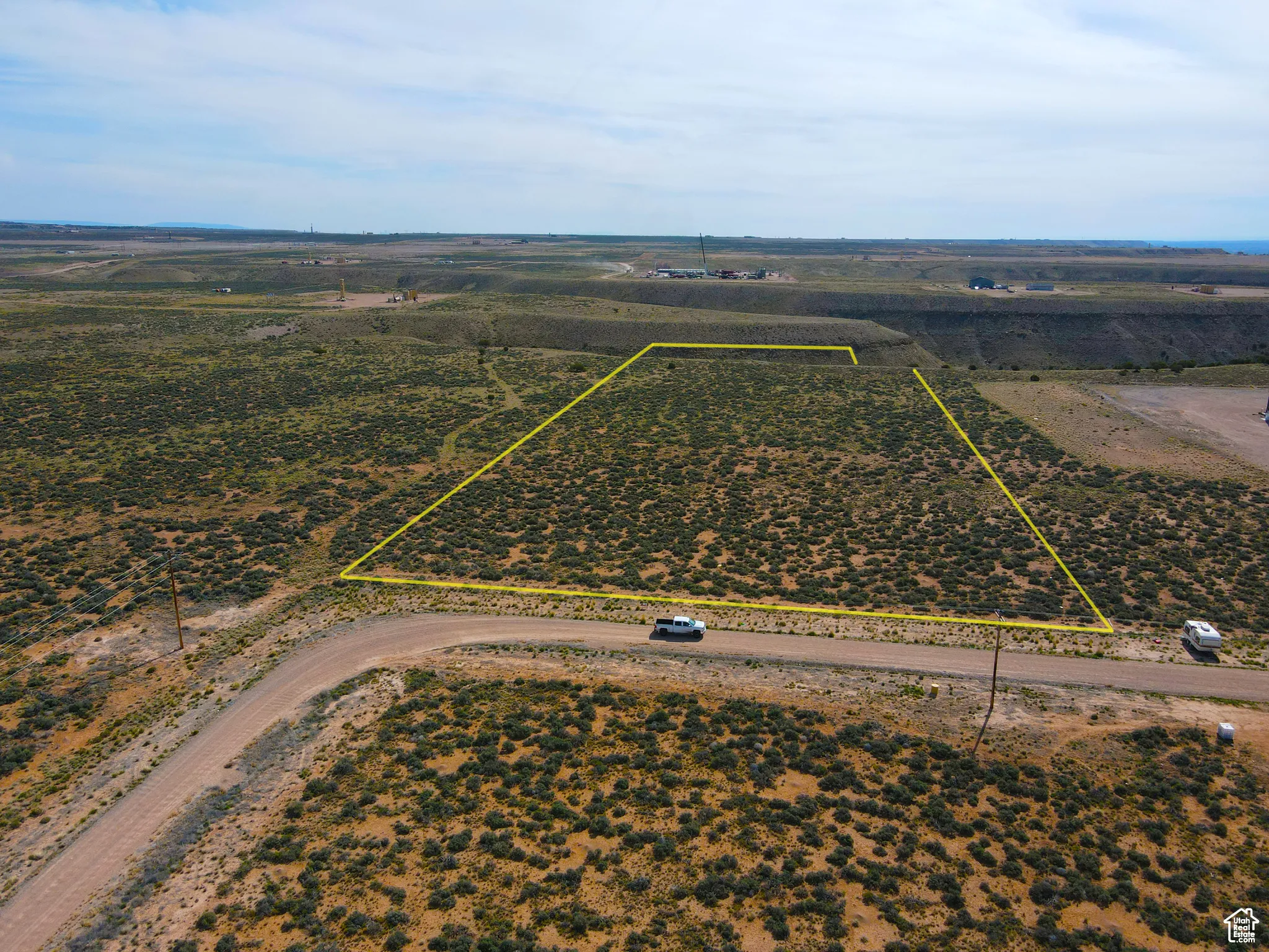 Aerial view of sparsely populated area with property boundaries highlighted
