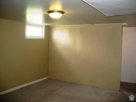 Empty room with carpet flooring