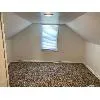 Additional living space featuring lofted ceiling