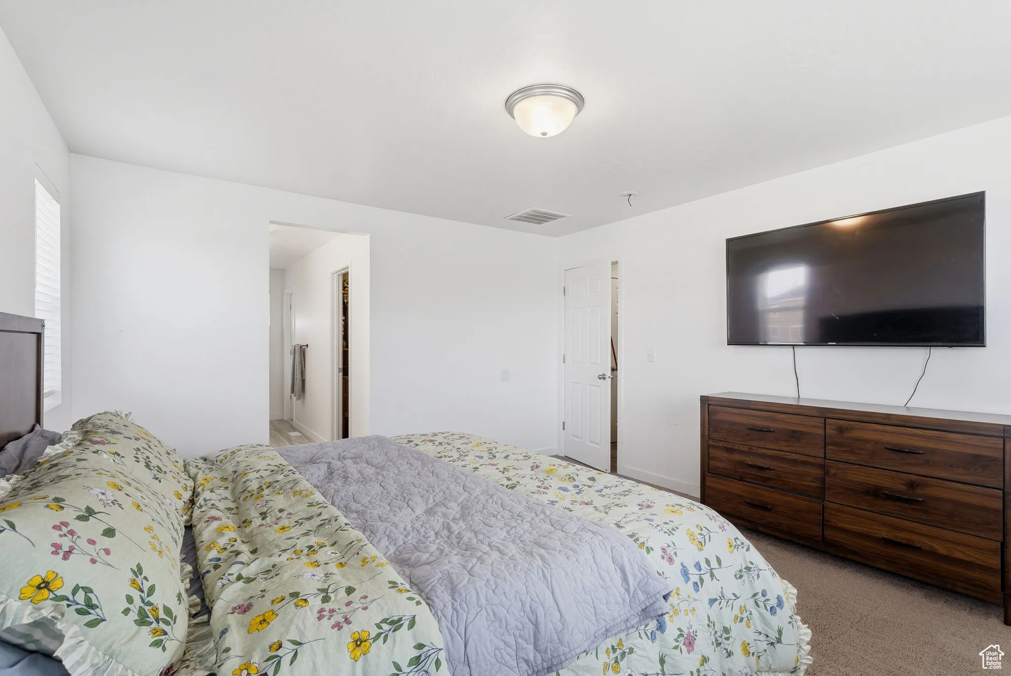 Carpeted bedroom with baseboards