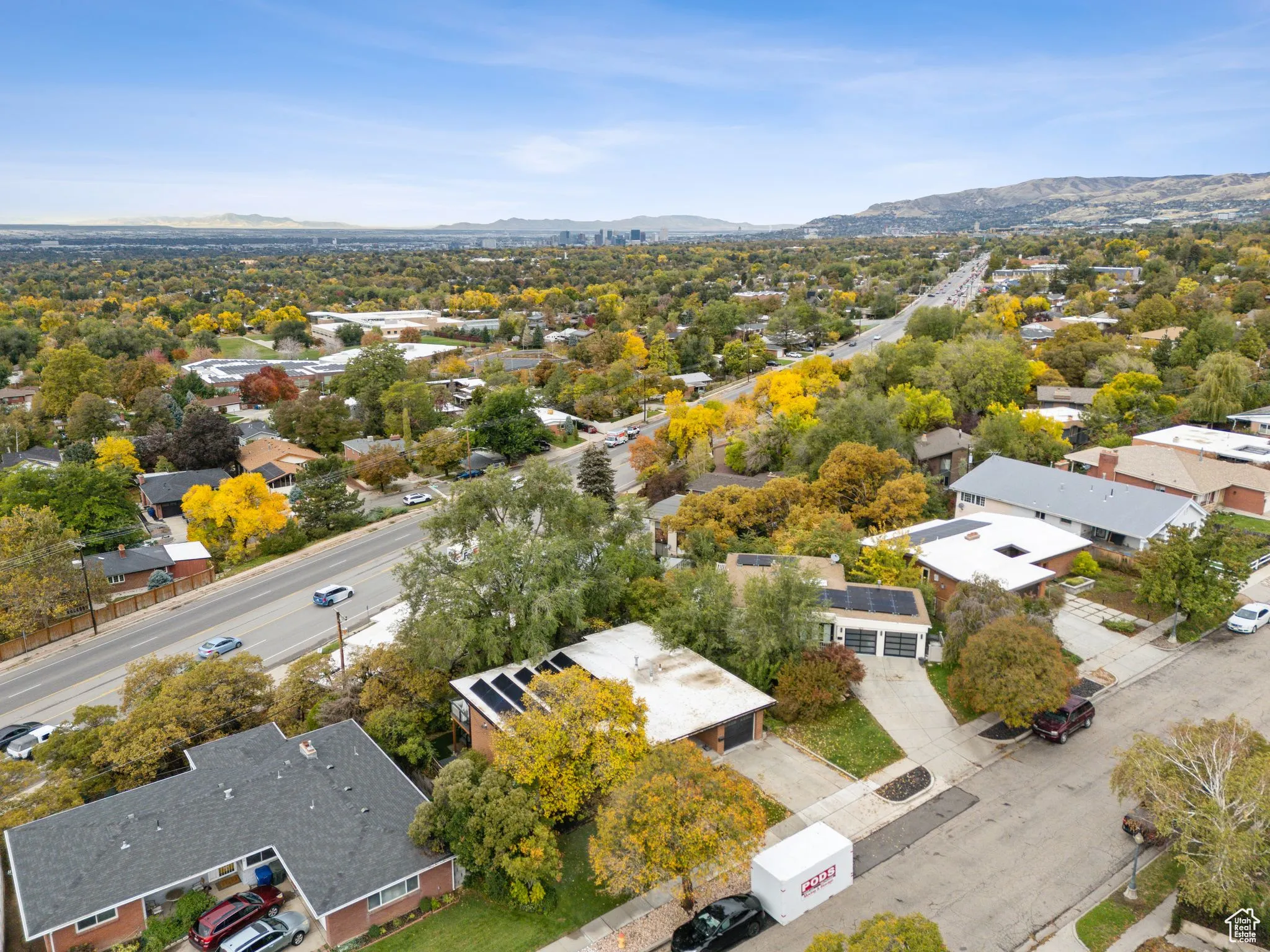 Aerial perspective of suburban area featuring a mountainous background