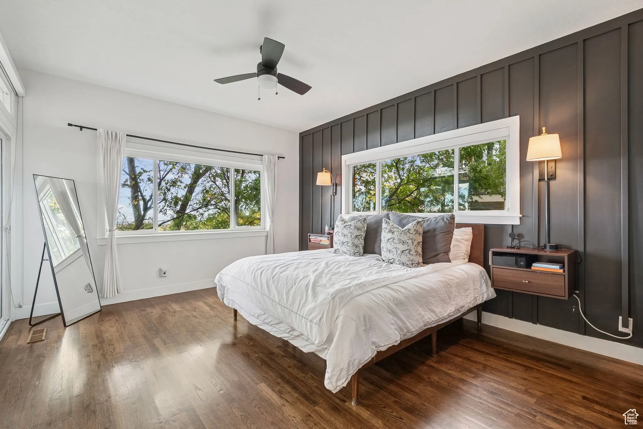 Bedroom with wood finished floors and a ceiling fan