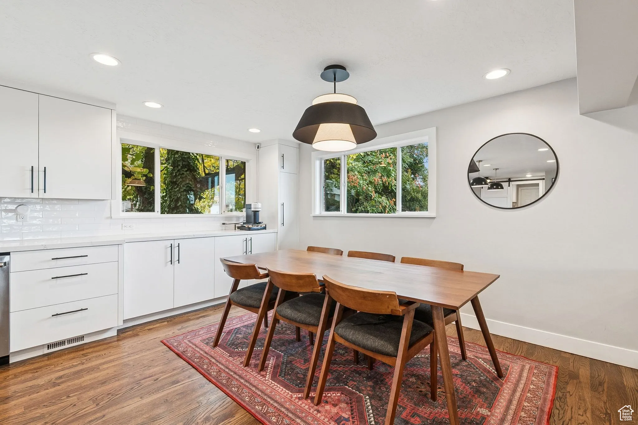 Dining area with healthy amount of natural light, recessed lighting, and light wood finished floors