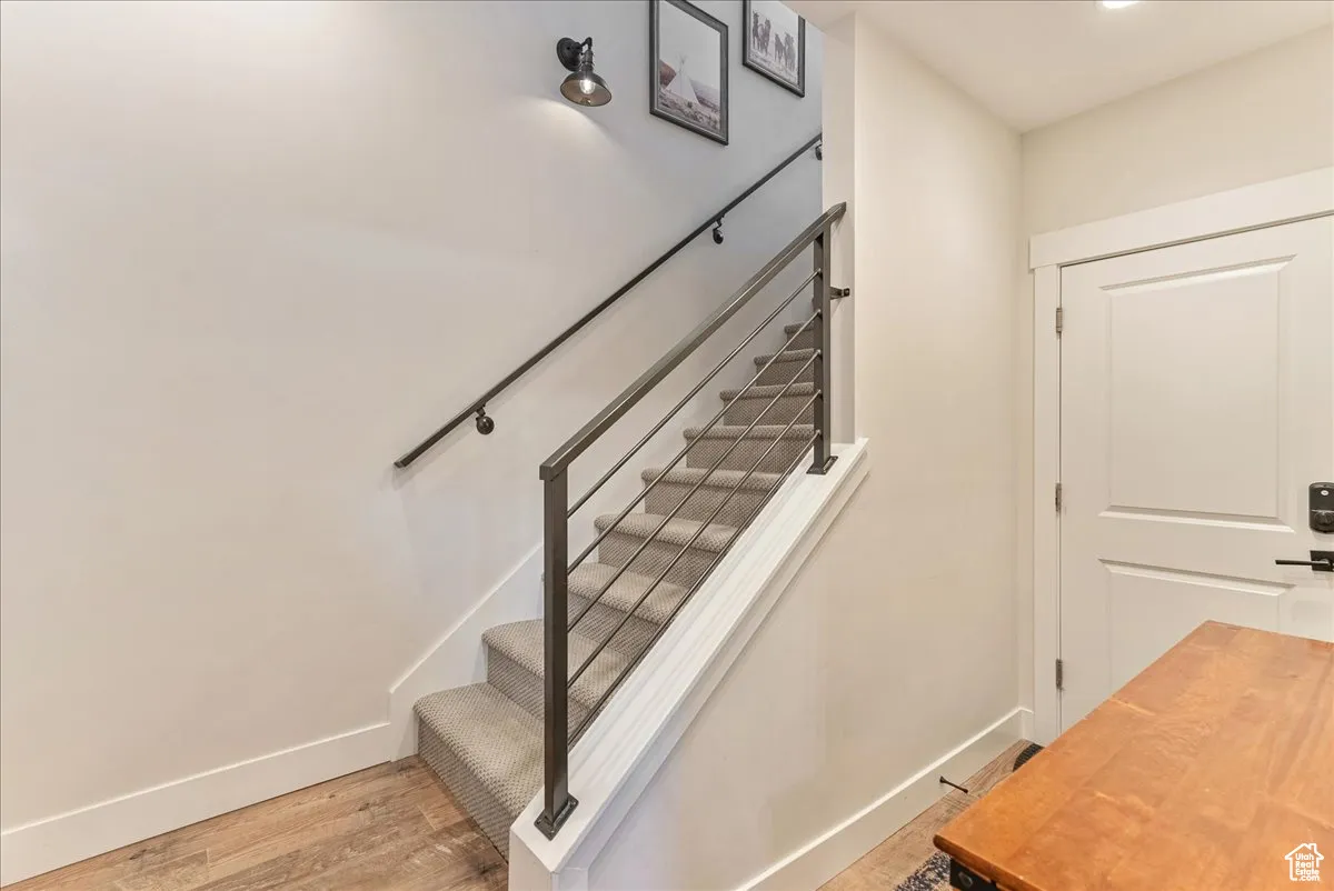 Stairway on first floor, door to the garage
