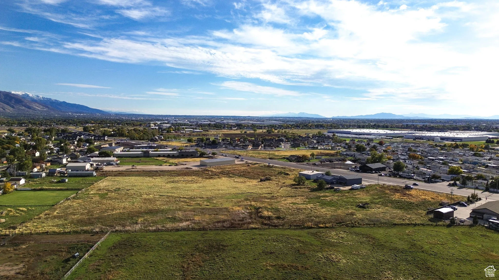 Aerial view of residential area featuring a mountain backdrop