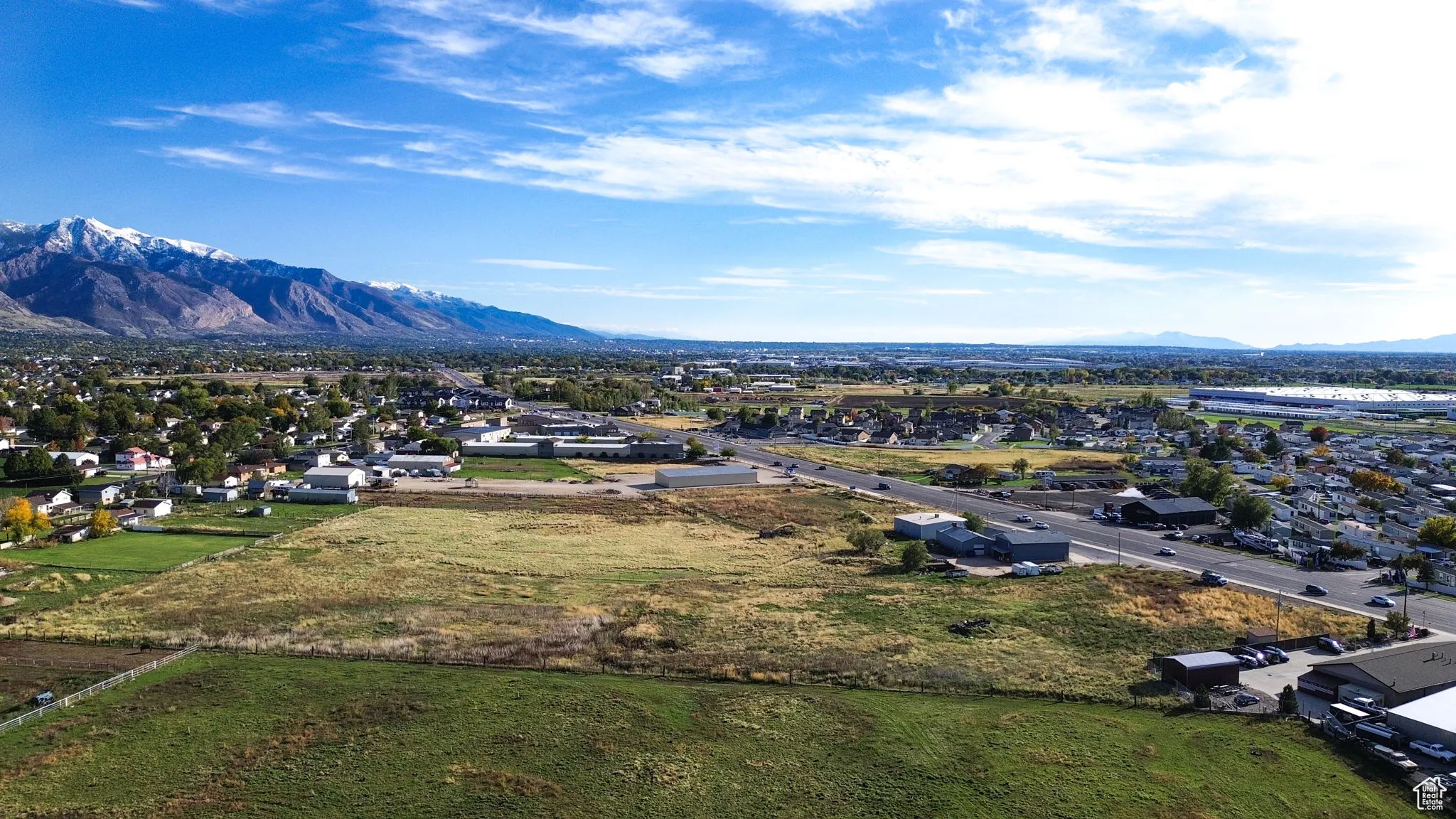 Aerial view of residential area featuring a mountain backdrop
