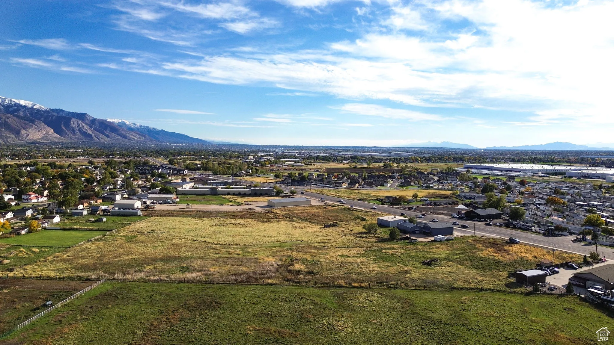 Aerial view of residential area featuring a mountain backdrop