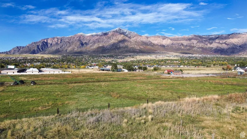 View of mountain backdrop with rural landscape