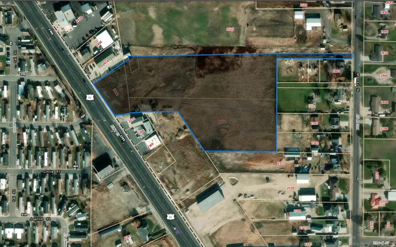 Aerial map of property and surrounding area featuring property parcel outlined