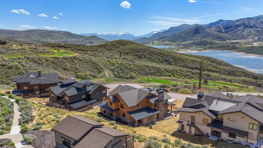 Modern mountain homes featuring multi-level designs and metal roofing