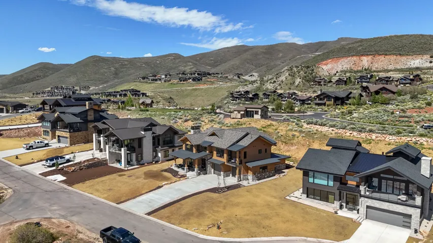 Contemporary residences featuring multi-level designs, integrated garages, and distinct material palettes