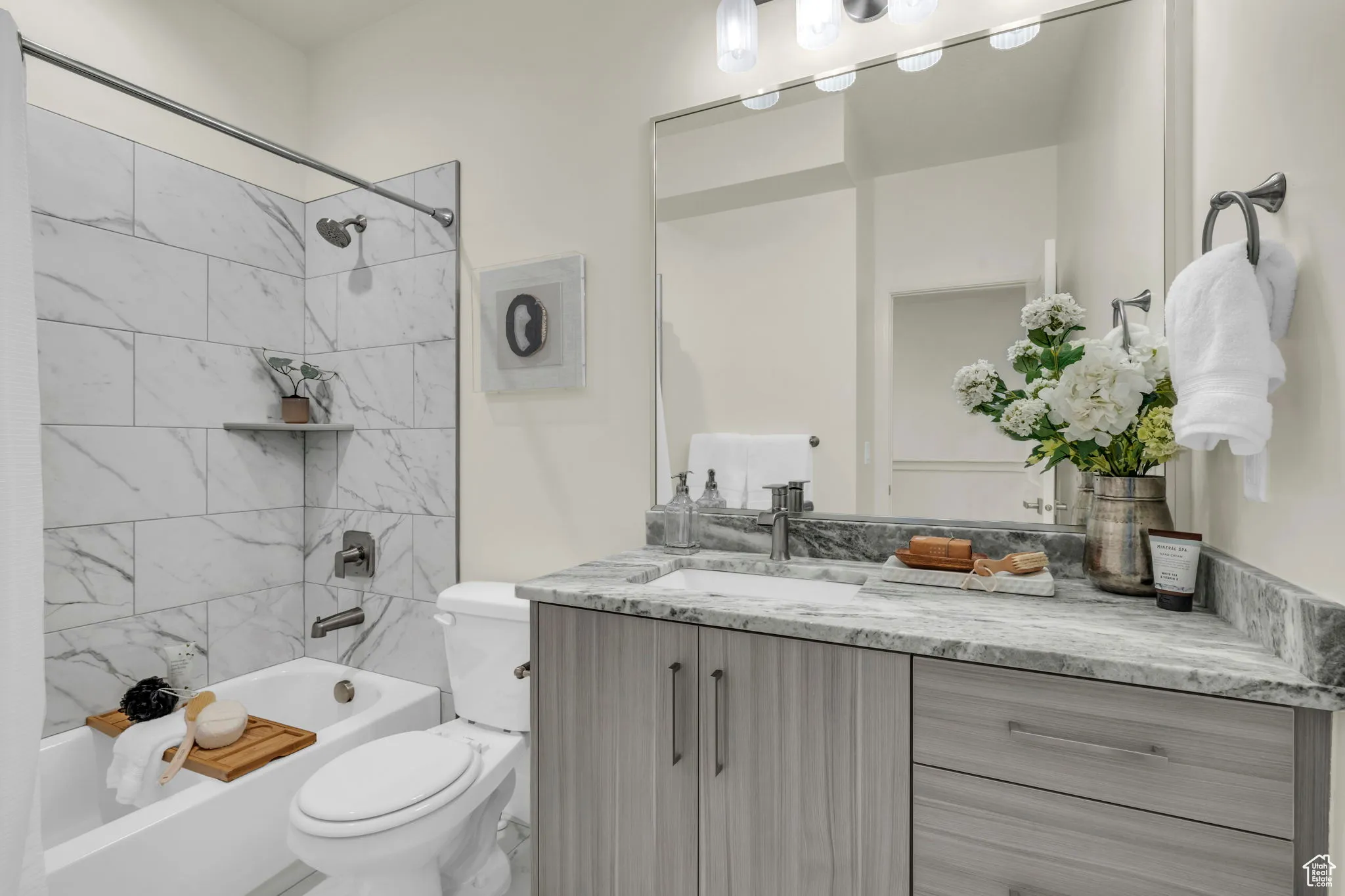 Full bathroom with tub / shower combination and vanity