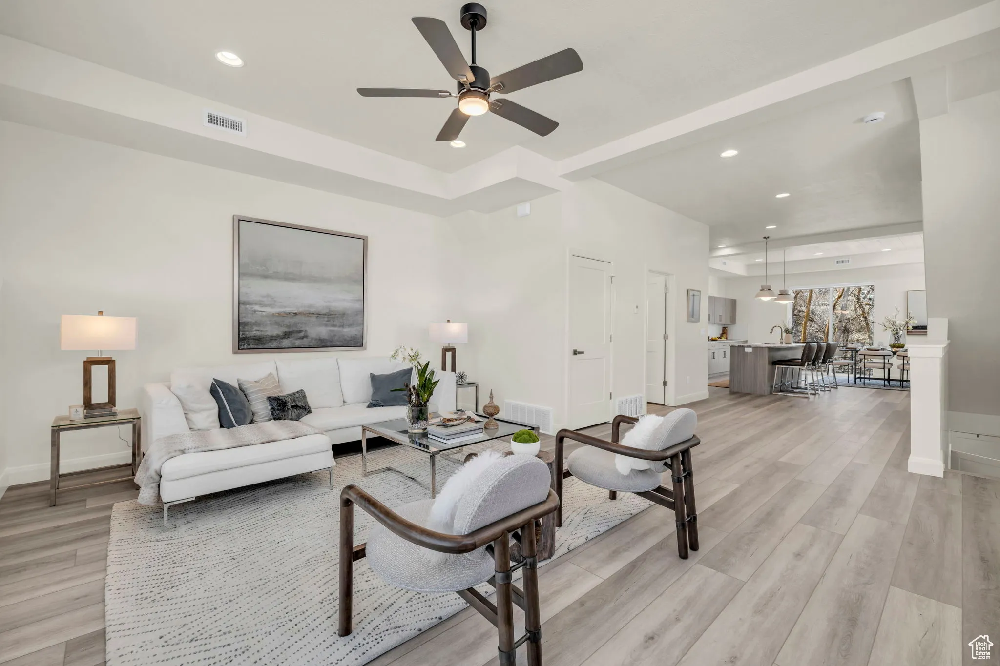 Living area featuring light wood-type flooring, recessed lighting, and ceiling fan
