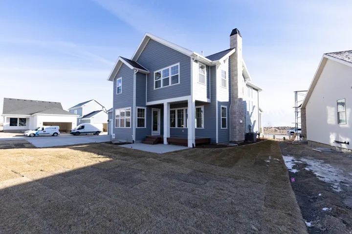 View of front of house featuring a chimney