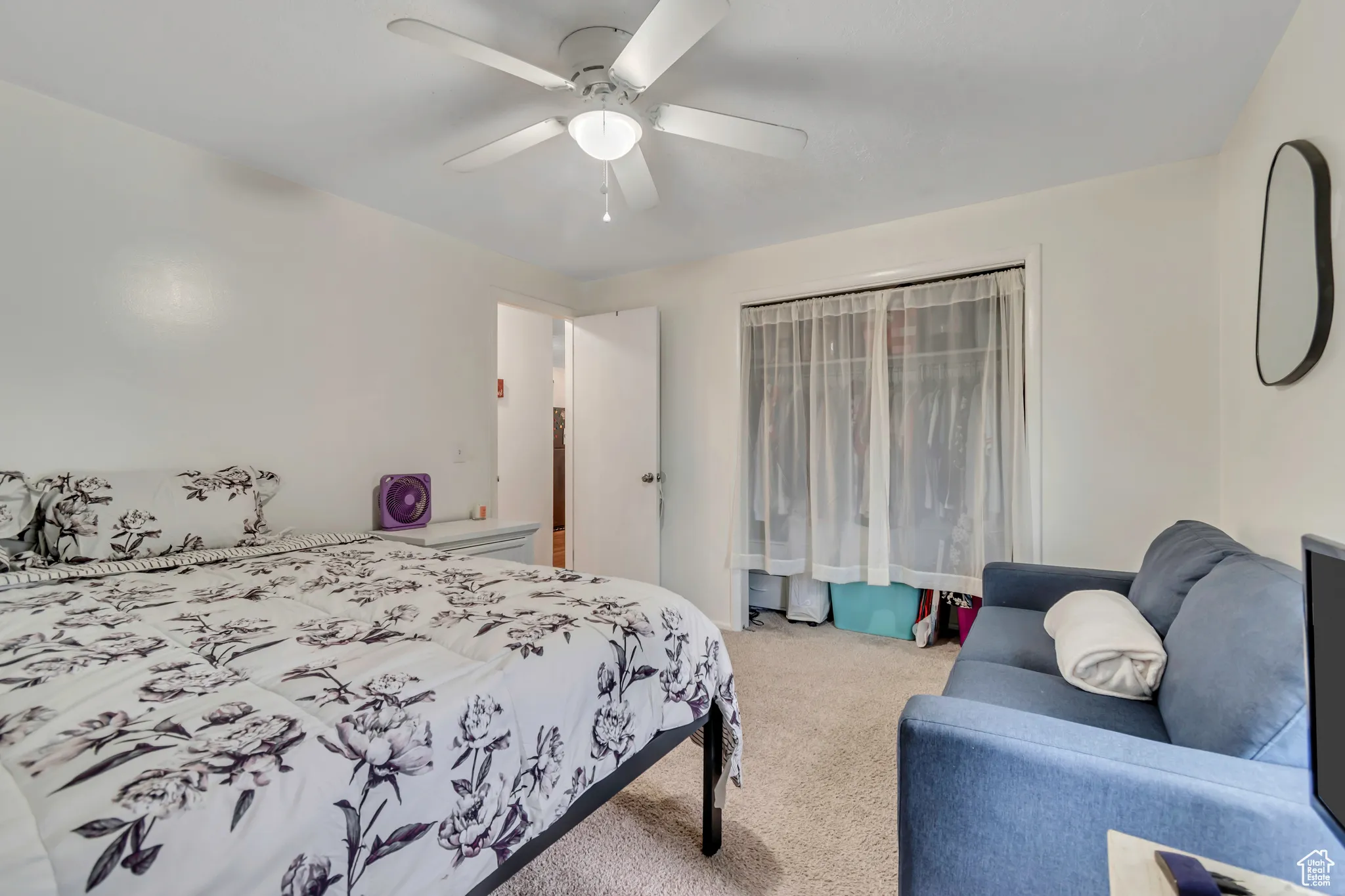 Bedroom with carpet and a ceiling fan